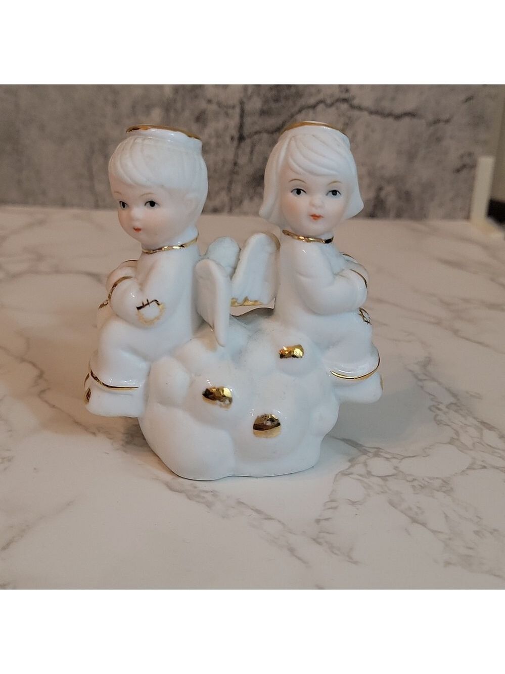 vintage two little angels sitting on a cloud figurine